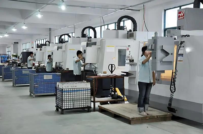 CNC Production Line – Operators running multiple machining centers